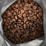 brown coffee beans on white plastic pack